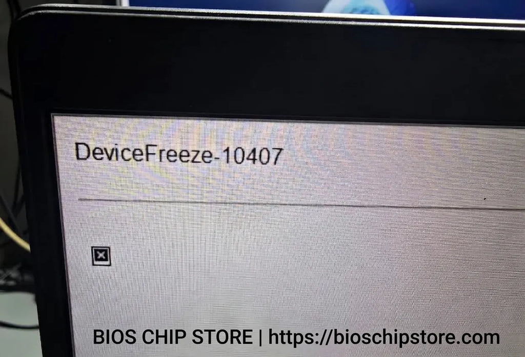 Dell laptop screen locked with an Absolute Computrace Device Freeze alert message.