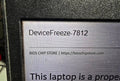 Lenovo ThinkPad laptop screen locked with an Absolute Computrace Device Freeze alert message.